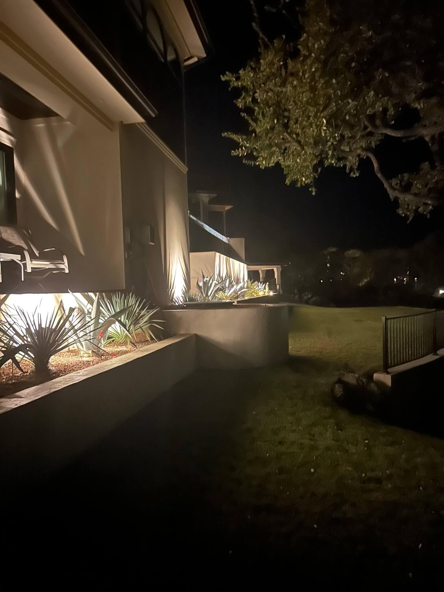 Landscape lighting with planter bed installation