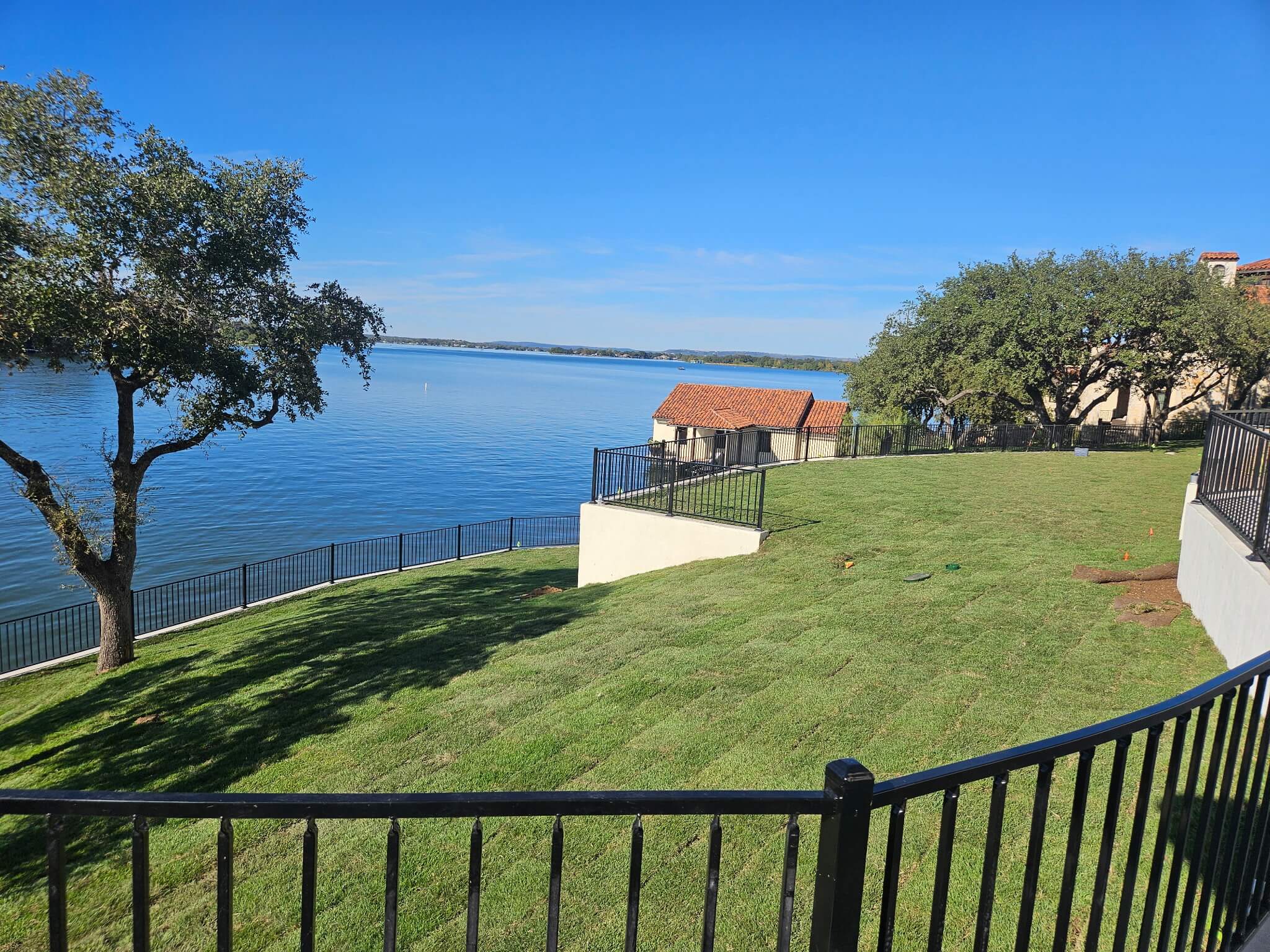 Fresh sod installation on lakefront property
